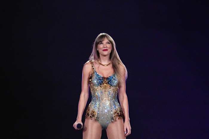 Taylor Swift looks into the crowd at SoFi Stadium